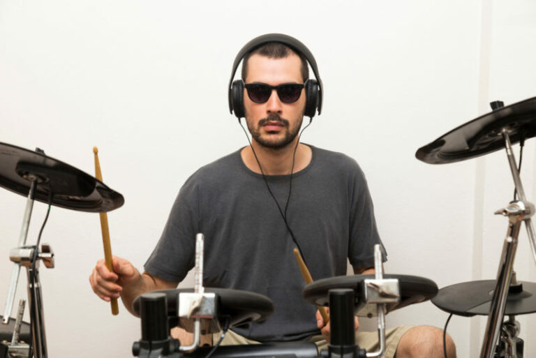why do drummers wear headphones